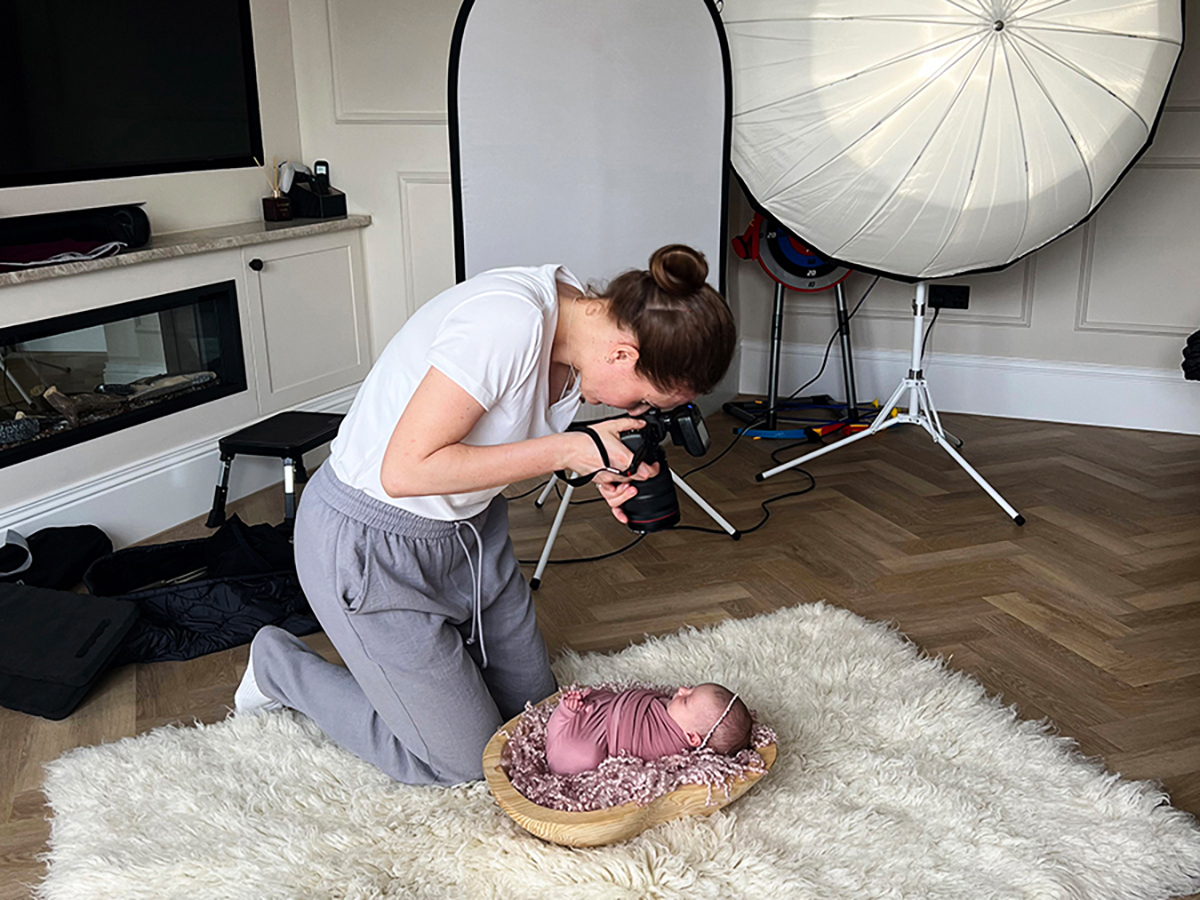 Mobile newborn photographer photographing a baby during an in-home newborn photoshoot in Essex.